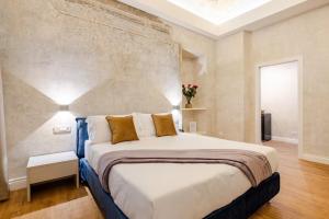 a bedroom with a large bed in a room at The Place 217 in Rome