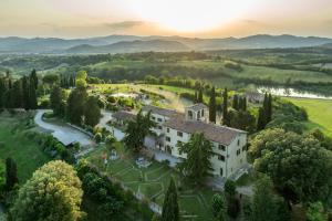 an aerial view of a building on a hill with trees at "Villa Bizzi" in Monte Castelli