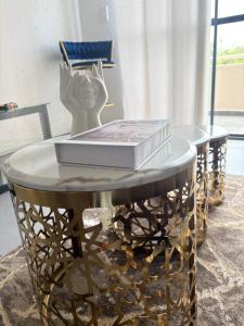 a table with a book on top of it at The golf estate gateway in Roodepoort