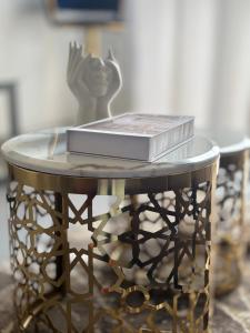 a book sitting on top of a glass table at The golf estate gateway in Roodepoort