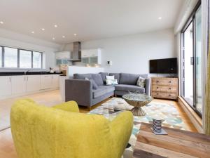 a living room with a couch and a table at 3 Bed in Bideford oc-52079 in Westward Ho