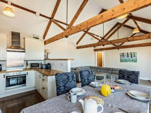 a kitchen and living room with a table and chairs at 3 Bed in Umberleigh oc-09092 in Umberleigh Bridge