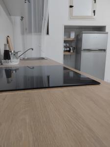 a kitchen with a glass counter top in a kitchen at Lucy Home in Pisticci