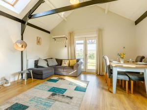 a living room with a couch and a table at 2 Bed in Umberleigh oc-09089 in Umberleigh Bridge