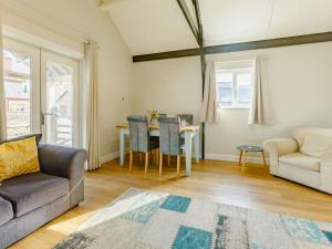 a living room with a couch and a table at 2 Bed in Umberleigh oc-09089 in Umberleigh Bridge +17 photos