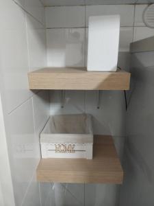 a box on a shelf in a room at Lucy Home in Pisticci