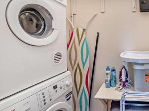 a laundry room with a washer and a washing machine at 3 Bed in Brecon oc-bn134 in Brecon