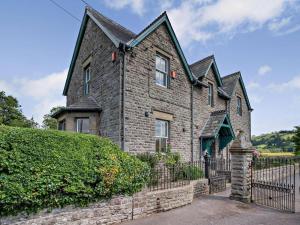 an old stone house with a black fence at 3 Bed in Brecon oc-bn134 in Brecon