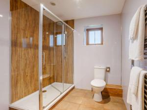 a bathroom with a shower and a toilet at 3 Bed in Bideford oc-89865 in Westward Ho +14 photos
