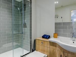 a bathroom with a sink toilet and a shower at 1 Bed in Bideford oc-55340 in Instow +11 photos