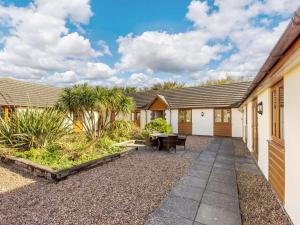 a property with a patio and a house at 3 Bed in Bideford oc-89866 in Westward Ho
