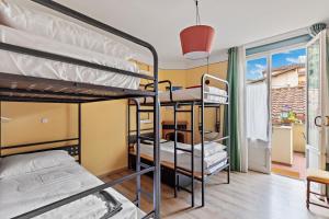 a room with bunk beds in a hostel at Ostello Bello Firenze in Florence