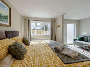 a large bed in a room with a window at 1 Bed in Barnstaple oc-91387 in Marwood