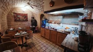 a kitchen with a counter and a table in a room at New Hôtel Gare Du Nord in Paris