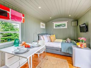 a bedroom with a bed and a table with fruit on it at 1 Bed in Paignton oc-93063 in Marldon