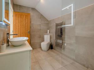 a bathroom with a sink and a toilet at 1 Bed in Paignton oc-93061 in Marldon +16 photos