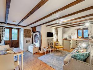 a living room with a couch and a table at 1 Bed in Yelverton oc-93333 in Yelverton