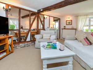 a living room with a couch and a table at 2 Bed in Exeter oc-90455 in Tedburn Saint Mary