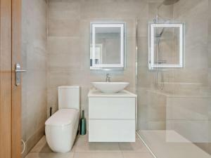 a white bathroom with a sink and a toilet at 2 Bed in Paignton oc-93062 in Marldon +25 photos