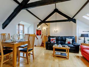 a living room with a couch and a table at 2 Bed in Bideford oc-housm in Clovelly