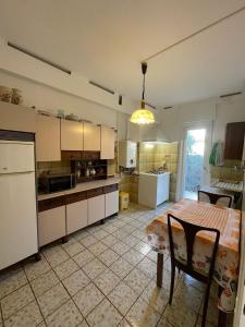 a kitchen with a table and a table and a dining room at Casa Nora in Trieste