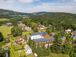 an aerial view of a small village in the mountains at Apartmán Šumavský skřítek in Čachrov