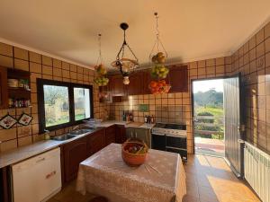 a kitchen with a table with a basket on it at Moledo Seaview in Moledo