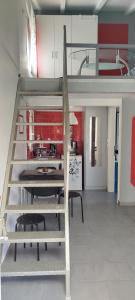 a kitchen with a loft bed in a room at Irida's House in Xylokastro