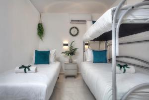 a bedroom with two bunk beds with blue pillows at Mountain Top Views -205- נופי פסגות in Safed