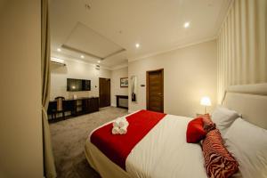 a bedroom with a large bed with two flowers on it at 49 Park Villa in Belgrade