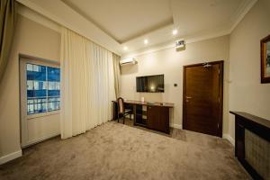 a hotel room with a desk and a window at 49 Park Villa in Belgrade +44 photos