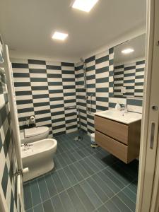 a bathroom with a sink and a tub and a toilet at La Dimora del Cardinale in Naples +41 photos