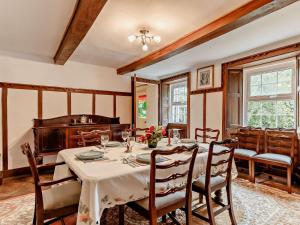 a dining room with a table and chairs at 4 Bed in Tavistock oc-92491 in Bulkworthy