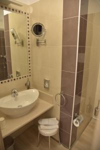 a bathroom with a sink and a shower at Hotel Floris in Rende +31 photos
