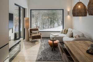 a living room with a couch and a table at steiRerBLiCke - Gaberhö Gamlitz in Gamlitz
