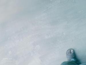a person riding a snowboard down a snow covered slope at Nalukettu Veedu in Thottada