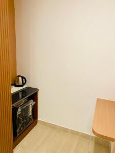a corner of a room with a white wall at Hotel Ananta in Sasarām