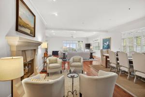 a living room with a table and chairs at EA1A: 1A Eugenia Avenue in Kiawah Island