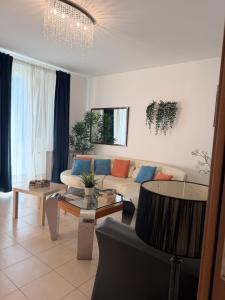 a living room with a couch and a table at Pool Apartment Bellagio in Bellagio