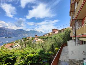 a view from a balcony of a city and a lake at Residence Casa Maria in Assenza di Brenzone