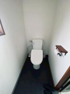 a bathroom with a white toilet in a room at おやど 瀬名 in Tanabe +30 photos
