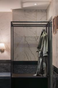 a mannequin in a glass case in a room at Dongdaemun Signature Tourist Hotel in Seoul +88 photos