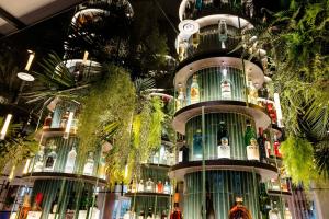 a building filled with lots of bottles of alcohol at Motel One Frankfurt-Hauptbahnhof in Frankfurt