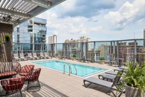an apartment patio with a swimming pool on a building at Viceroy Chicago in Chicago