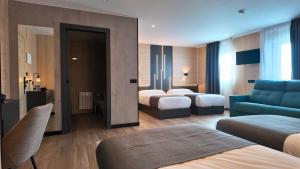 Llit o llits en una habitació de Hotel Focus