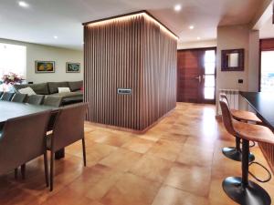 a living room with a table and a couch at Casa Migjorn in Valls de Torroella