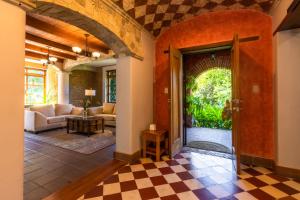 a living room with an open door to a living room at Casa Historica Atitlán in Panajachel