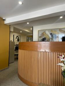 a lobby with a wooden fence and a reception desk at SOFT HOTEL in Douala