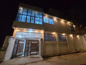 a building with lights on top of it at night at Parth Guest House in Ayodhya +33 photos