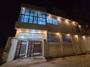 a house with lights on top of it at night at Parth Guest House in Ayodhya